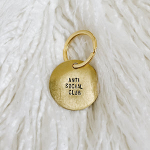 anti social club brass tag