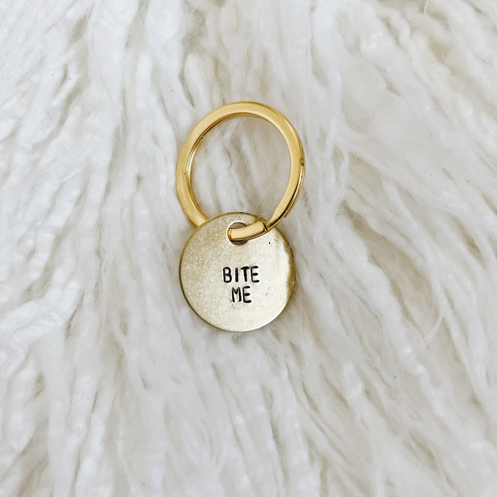 bite me mini brass tag