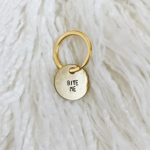 bite me mini brass tag